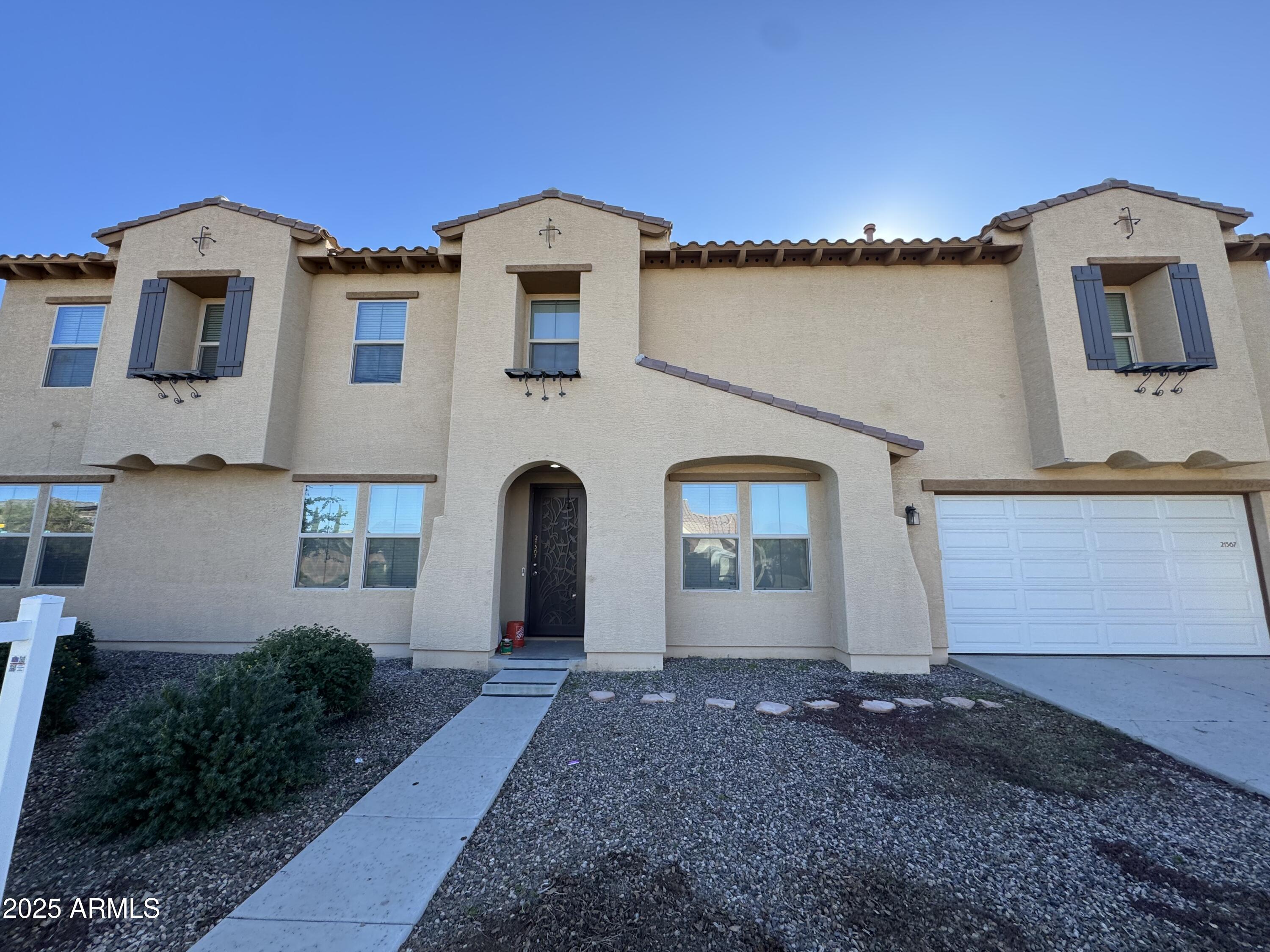 21367 Vía De Arboles Queen Creek, AZ 85142 - Photo 1 of 2 a front view of a house with windows
