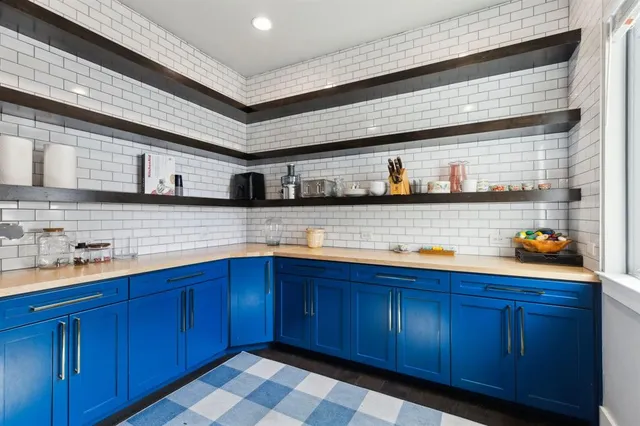 a kitchen with wooden cabinets
