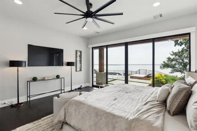 a bed room with a bed and a large window