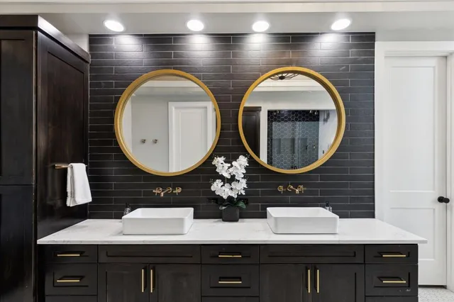 a bathroom with a double vanity sink and a mirror