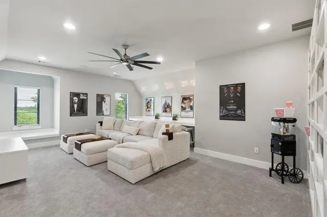 a bedroom with a balcony a bed and glass walk in closet
