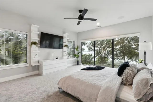 a bed room with furniture and a window