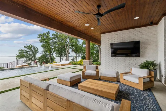 a view of a house with a balcony and trees