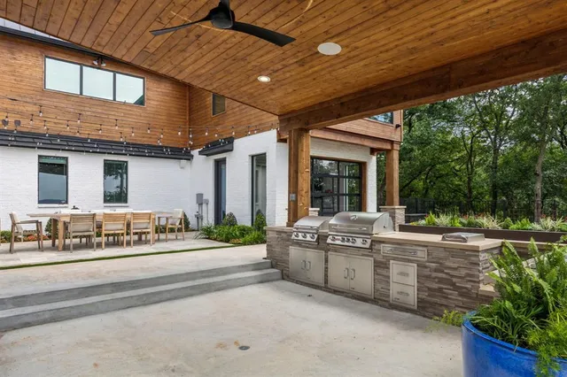 a view of a house with pool and sitting area
