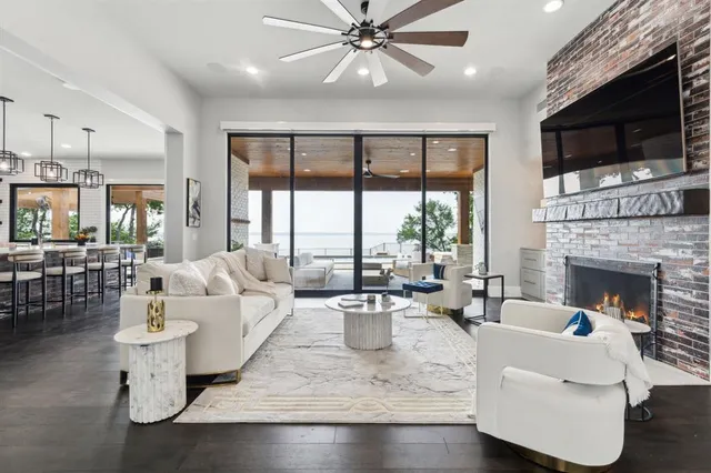 a living room with fireplace furniture and a flat screen tv