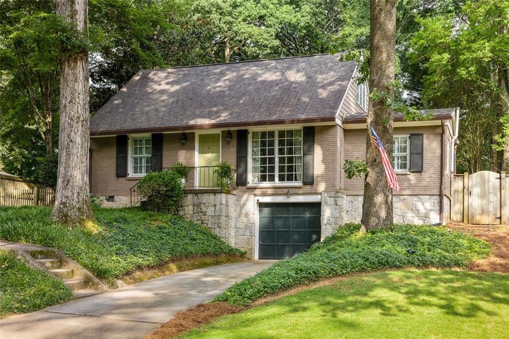 2805 Ridgemore Road Northwest Atlanta, GA 30318 - Photo 1 of 1 a view of house with a yard and a garden