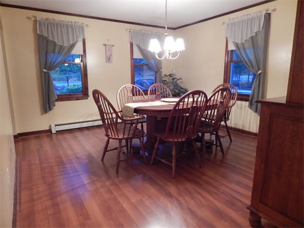 37 Howland Road Lakeville, MA 02347 - Photo 5 of 14 a view of a dining room with furniture wooden floor and chandelier