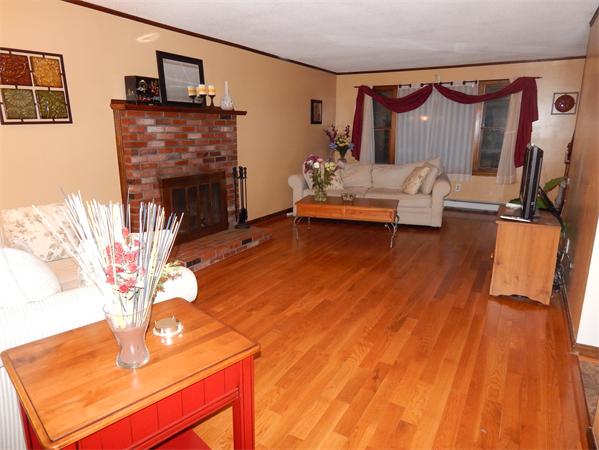 37 Howland Road Lakeville, MA 02347 - Photo 7 of 14 a living room with furniture and a fireplace