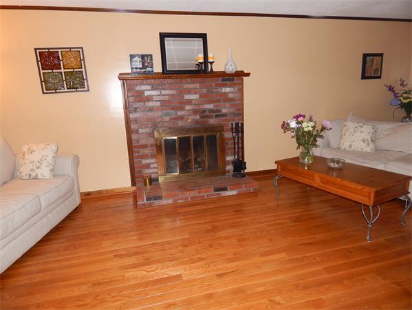 37 Howland Road Lakeville, MA 02347 - Photo 8 of 14 a living room with furniture and a fireplace