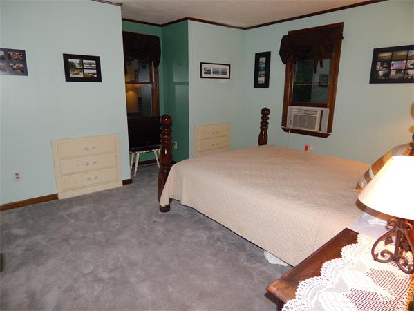 37 Howland Road Lakeville, MA 02347 - Photo 9 of 14 a bedroom with a bed and a desk