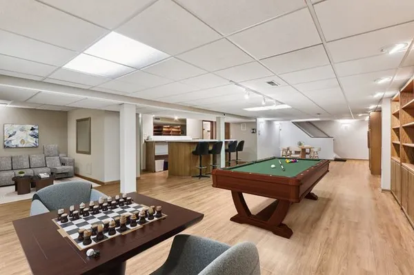 a kitchen with refrigerator and cabinets