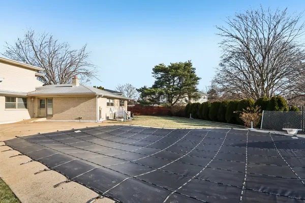 a view of a house with a yard and garage