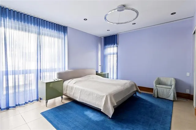 a bathroom with a sink a toilet a mirror a bathtub and shower