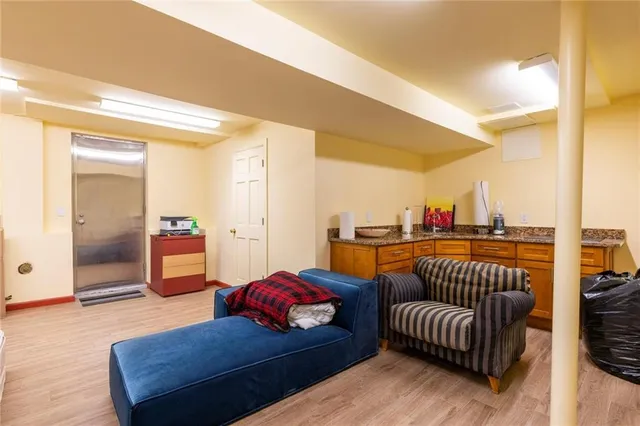 a bathroom with a toilet a sink and shower