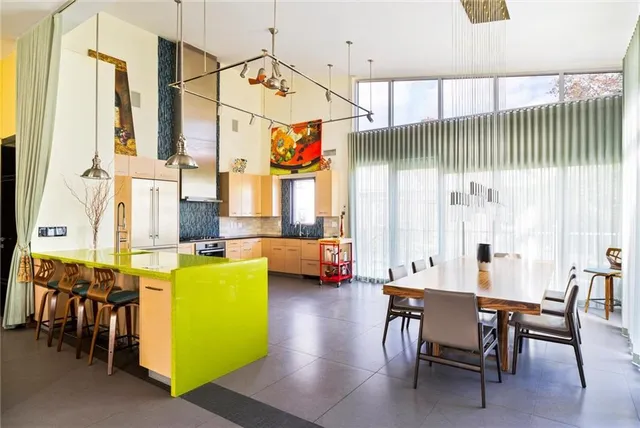 a view of a dining room with furniture window and outside view