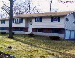 a view of a house with a swimming pool