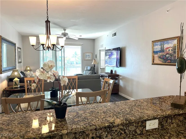 a living room with furniture window and wooden floor