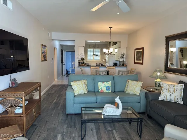 a living room with furniture fireplace and a flat screen tv