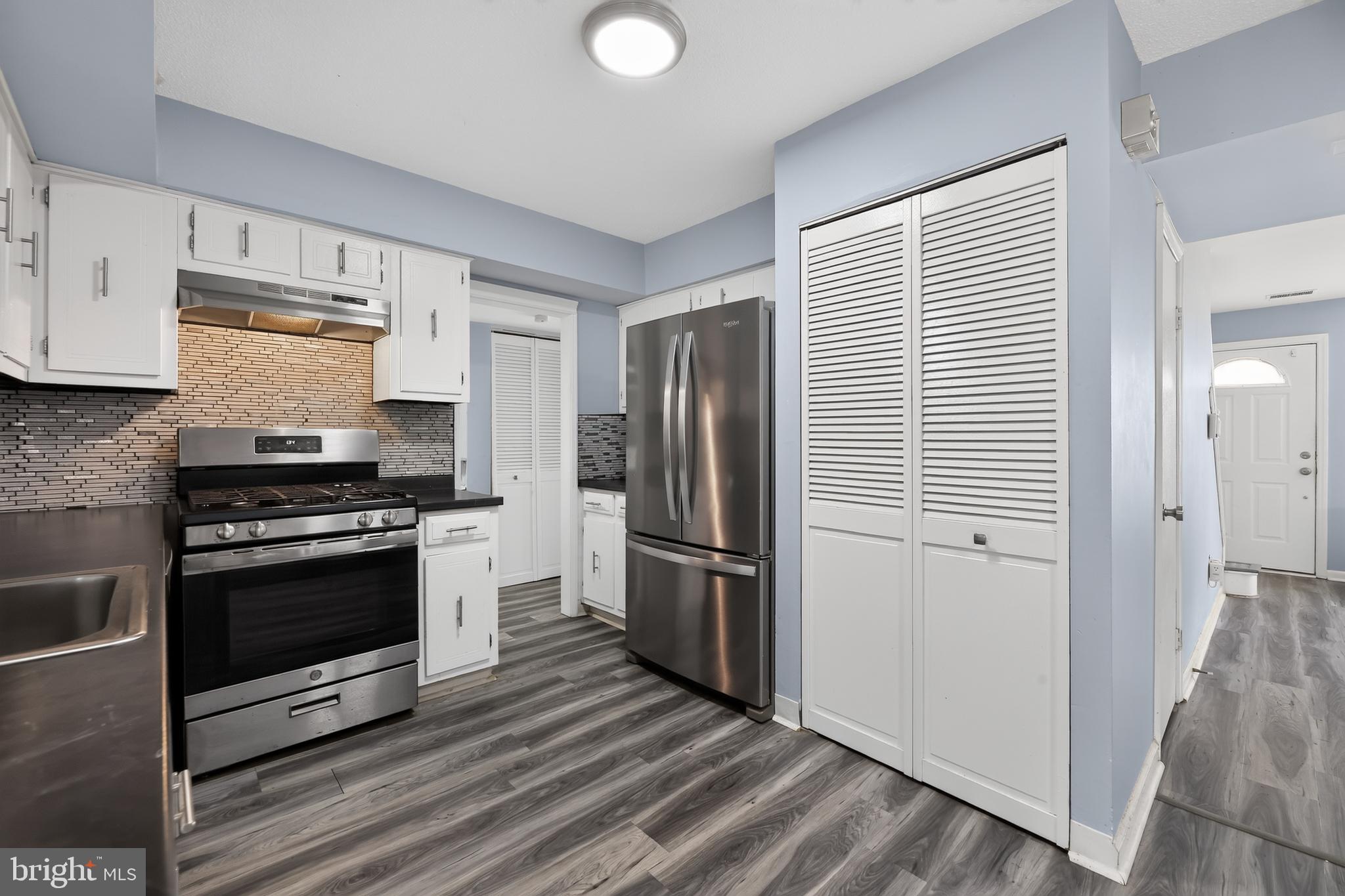 1802 Winding Way Clementon, NJ 08021 - Photo 11 of 30 a kitchen with granite countertop a refrigerator and a stove top oven