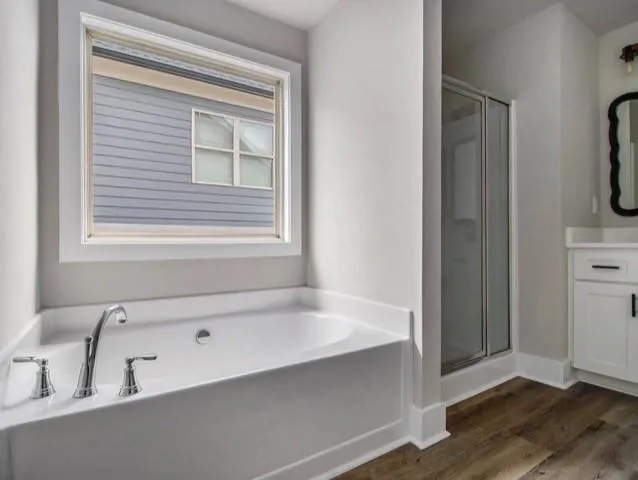 a bathroom with a bathtub and a sink