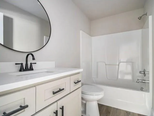 a bathroom with a sink a toilet and a bathtub