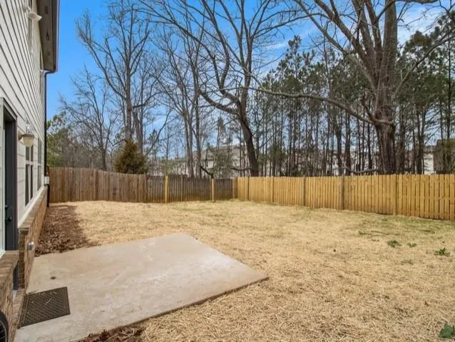 a white house covered with snow in front of house