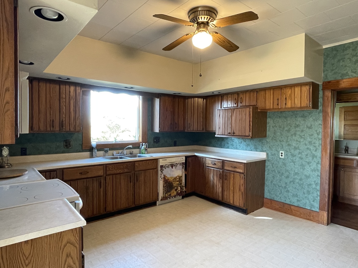 16580 West 5000S Road Buckingham, IL 60917 - Photo 9 of 35 a kitchen with granite countertop a sink cabinets and window