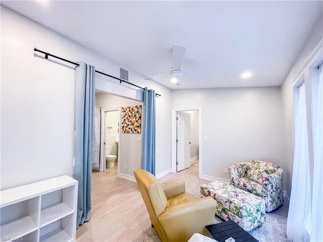 a living room with furniture and a gate