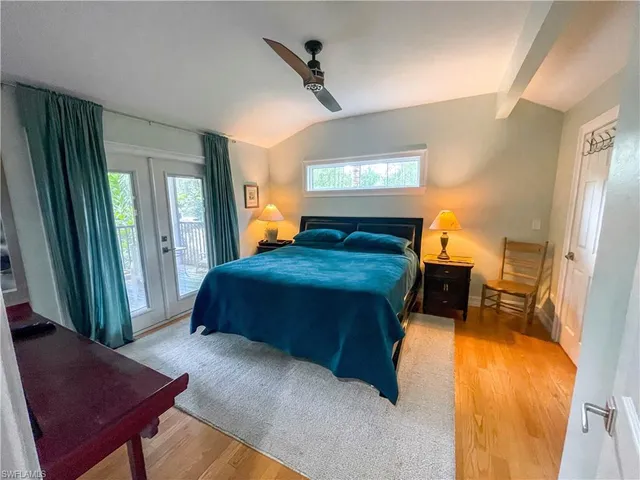 a bathroom with a glass door shower and a sink