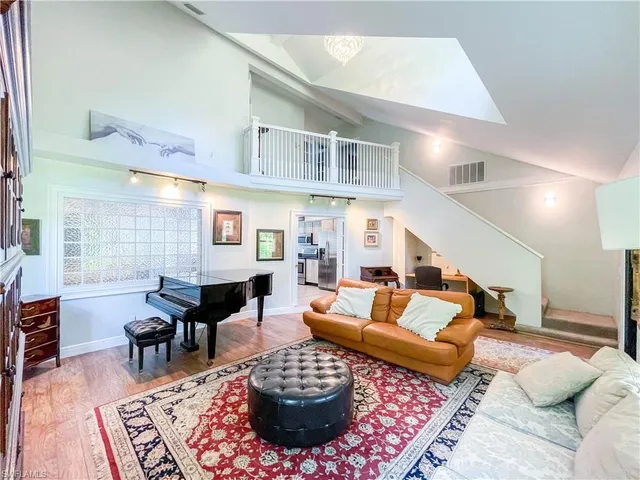 a living room with furniture and a rug
