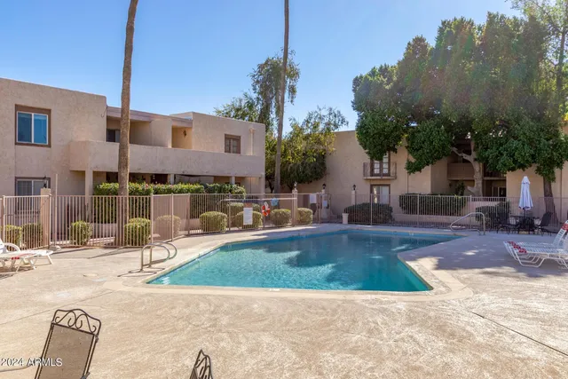 a garden view with a fountain
