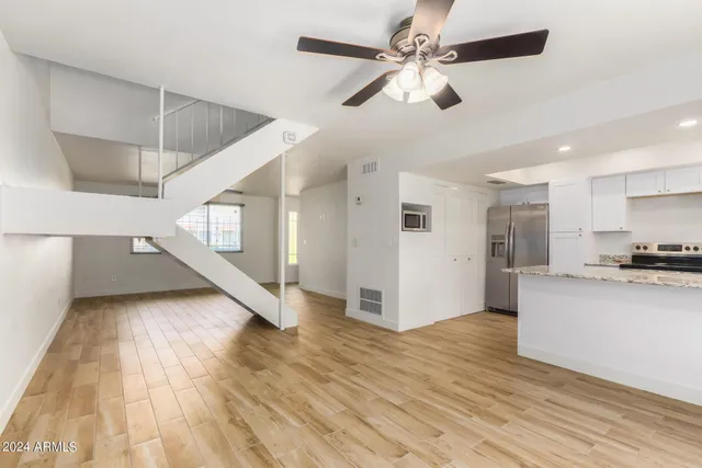 a view of kitchen with cabinets and wooden floor