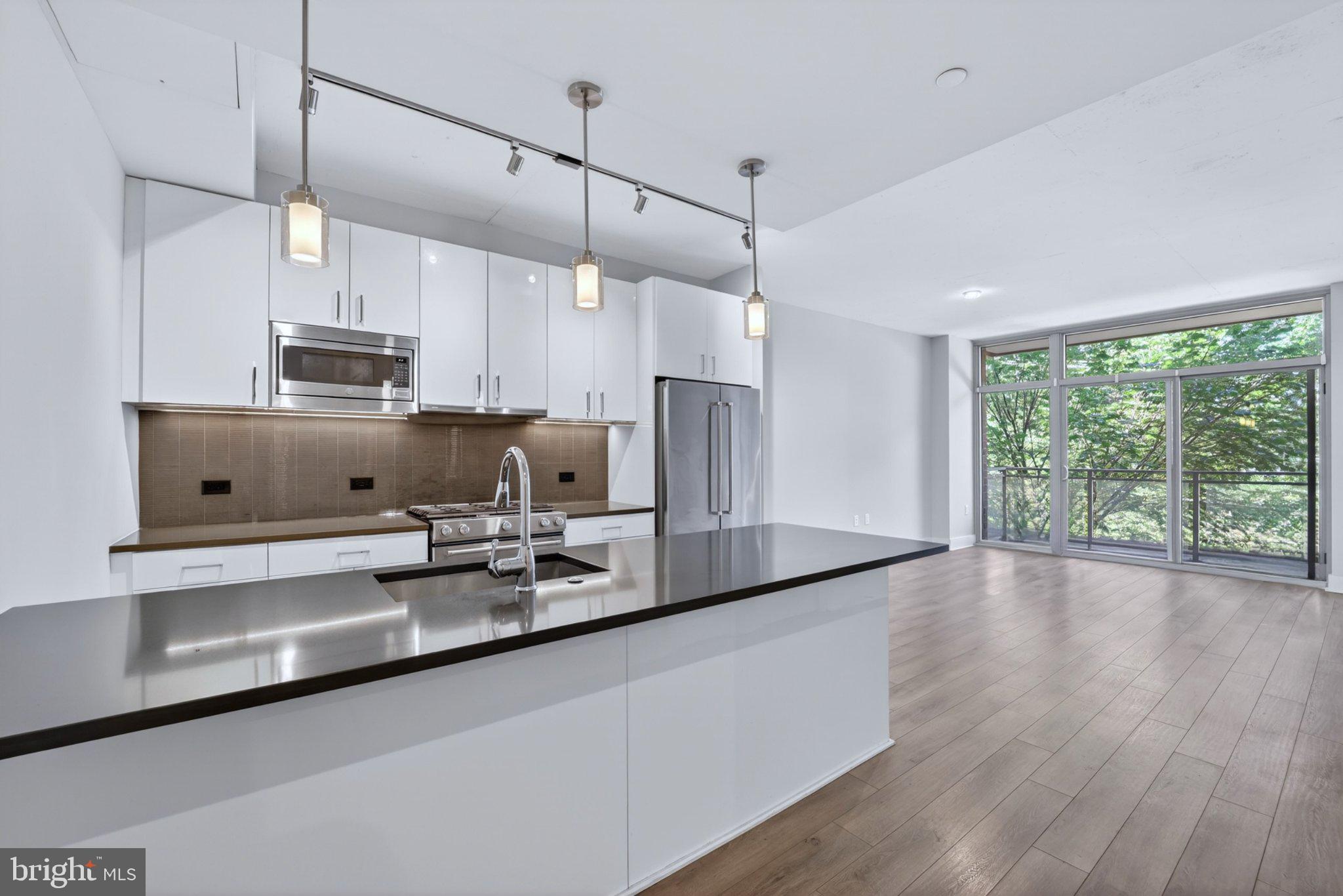88 V Street Southwest, Unit 213 Washington, DC 20024 - Photo 3 of 26 Sleek modern kitchen with natural light.