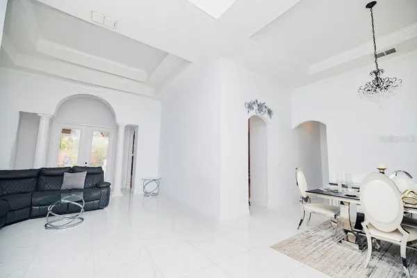 a large kitchen with a large counter top stainless steel appliances and cabinets