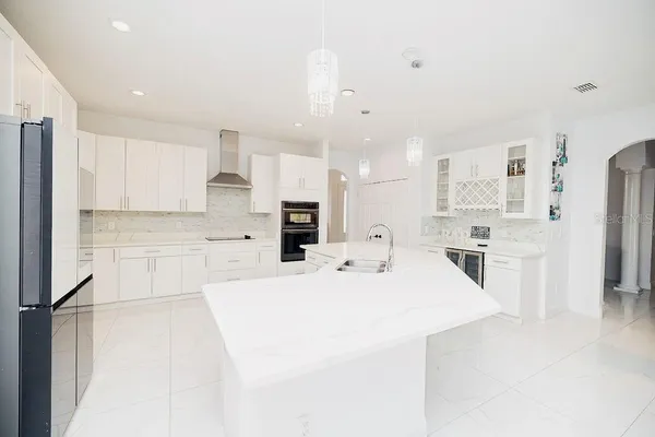 a room with a bed and a flat screen tv