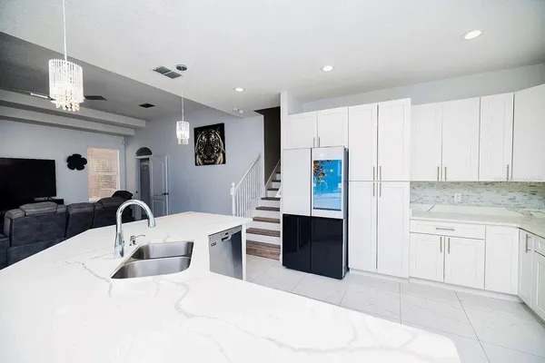 a bedroom with a bed and a night stand