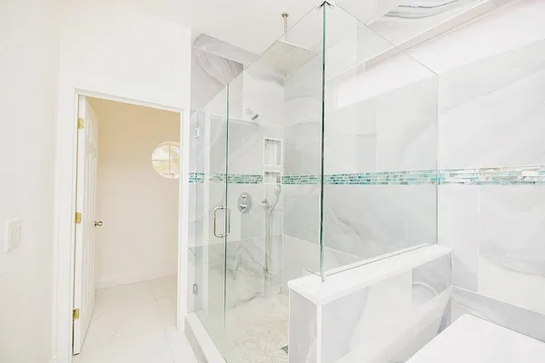 a bathroom with a shower and a sink