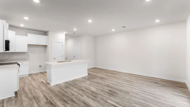 a view of kitchen with wooden floor