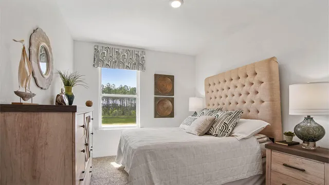 a bedroom with a bed and a dresser