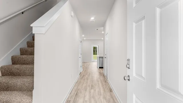 a view of a hallway with a white walls