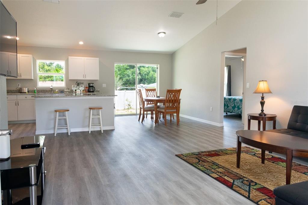 20109 Southwest 84th Street Dunnellon, FL 34431 - Photo 3 of 10 a living room with furniture a window and wooden floor