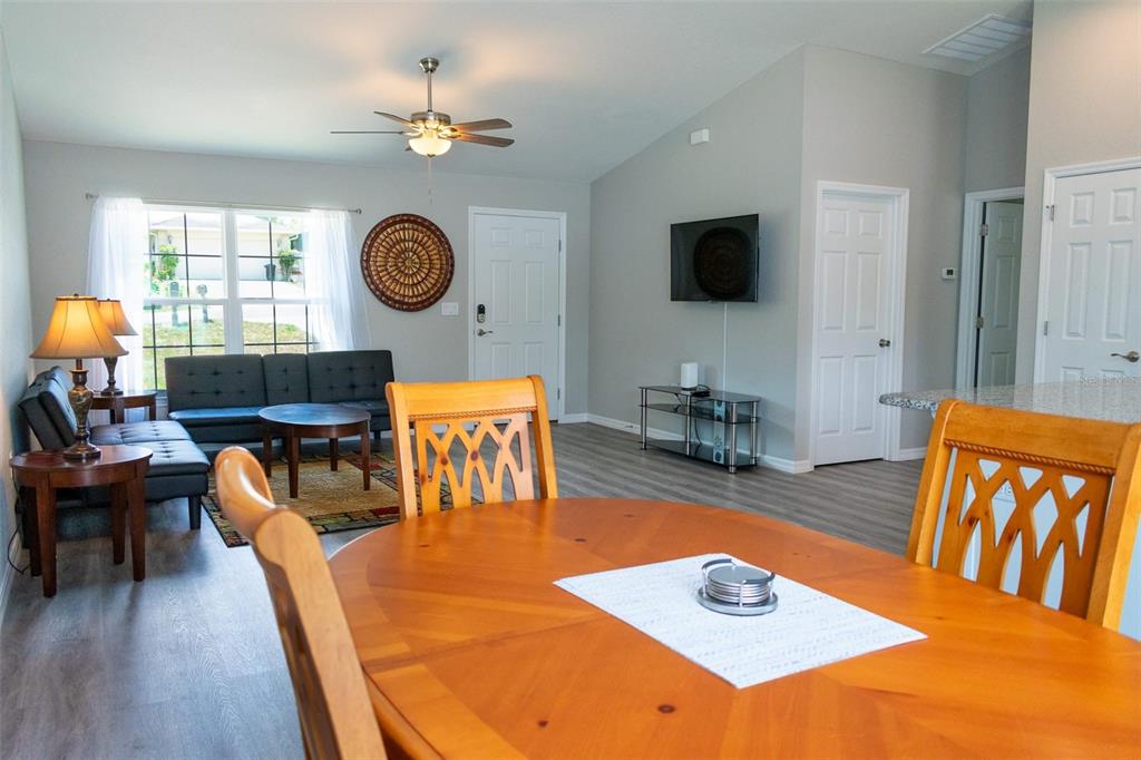 20109 Southwest 84th Street Dunnellon, FL 34431 - Photo 5 of 10 a living room with furniture and a flat screen tv