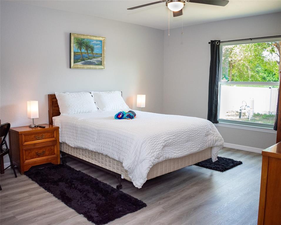 20109 Southwest 84th Street Dunnellon, FL 34431 - Photo 6 of 10 a bedroom with a bed and a large window
