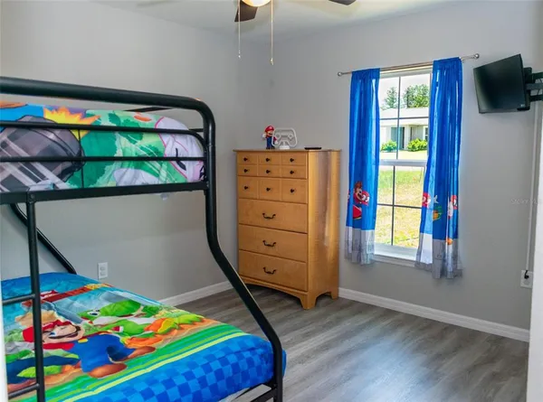 a bed room with furniture and a window