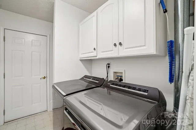 a kitchen with a stove and a refrigerator