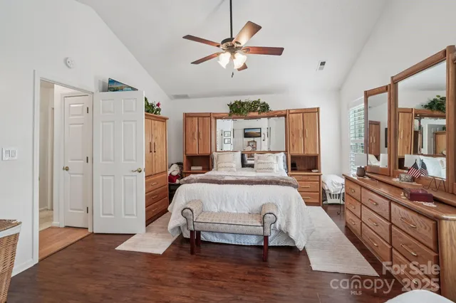 a bed room with a bed and a window