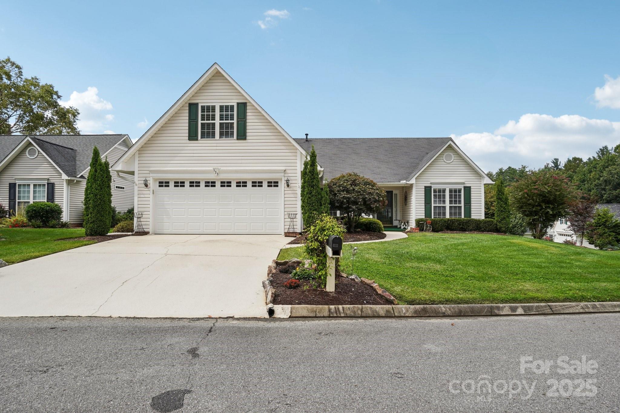 133 Stonehollow Road Fletcher, NC 28732 - Photo 2 of 29 a front view of a house with a yard and garage
