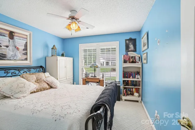 a bedroom with a bed furniture and a window