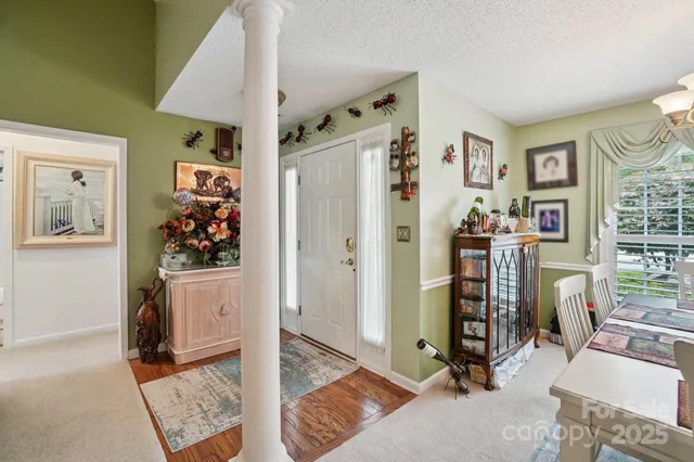 a view of a livingroom with workspace and a window