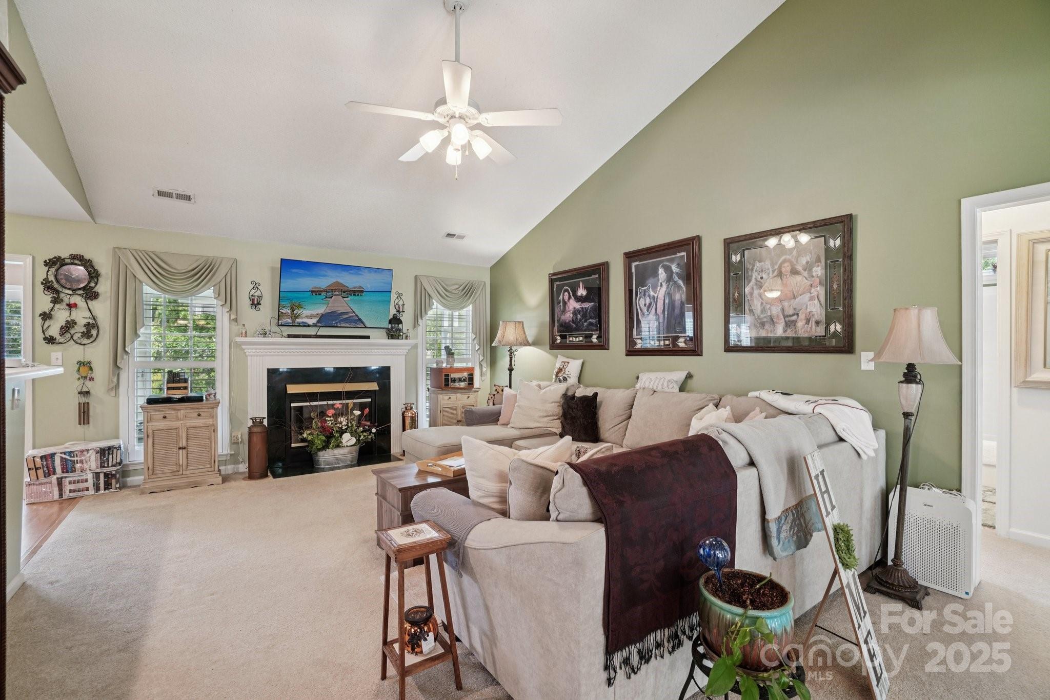 133 Stonehollow Road Fletcher, NC 28732 - Photo 5 of 29 a living room with furniture and a fireplace